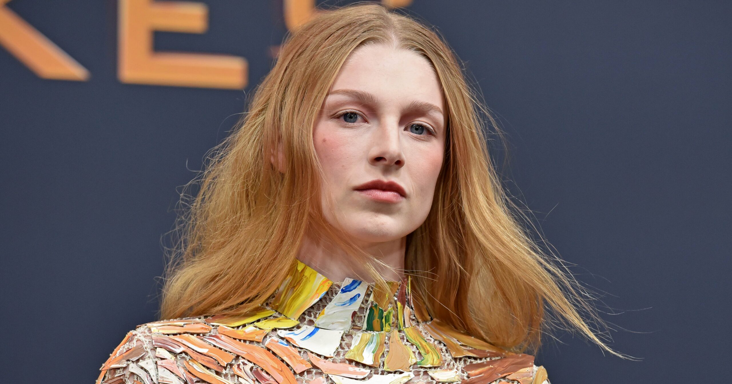 hunter-schafer-drips-down-the-red-carpet-in-a-hand-painted-puzzle-piece-dress