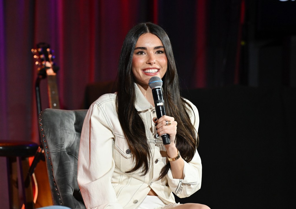 madison-beer-embraces-coquette-trend-in-ruffled-miniskirt-and-helmut-lang-jacket-at-the-grammy museum