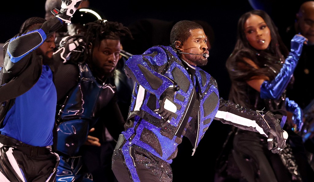 usher-sparkles-in-embellished-off-white-‘tron’-inspired-suit-and-roller-skates-for-super-bowl-2024-halftime-show performance