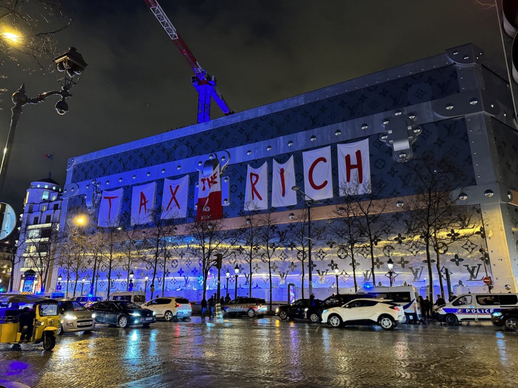 activists-target-louis-vuitton-building-on-the-champs-elysees