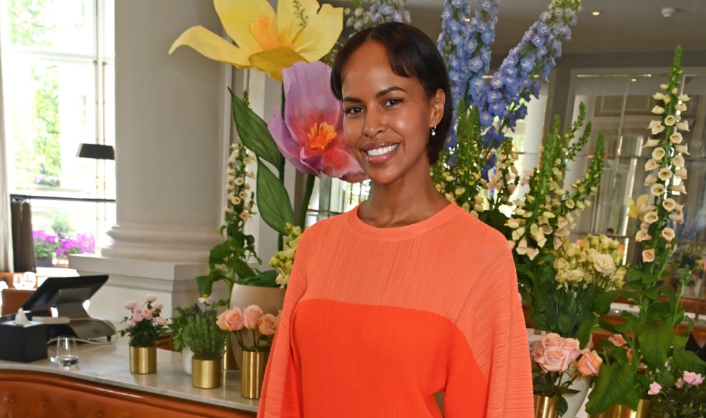 sabrina-elba-pops-in-vibrant-orange-stella-mccartney-knit-dress-with-voluminous-sleeves-for-london-luncheon event