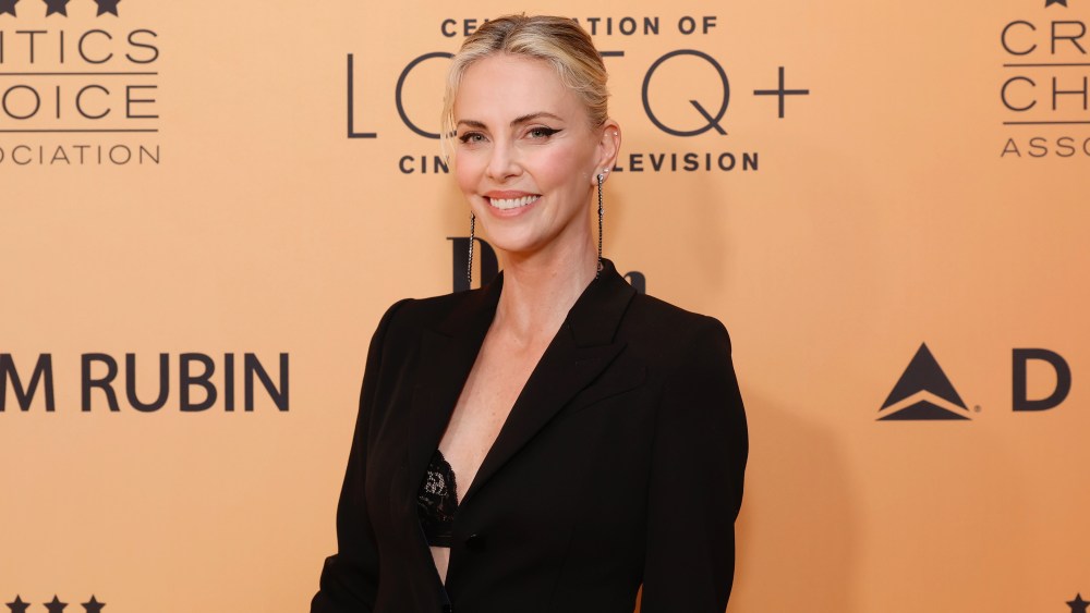 charlize-theron-embraces-the-peekaboo-bra-layering-trend-with-lace-details-at-critics’-choice-lgbtq-cinema-&-television celebration