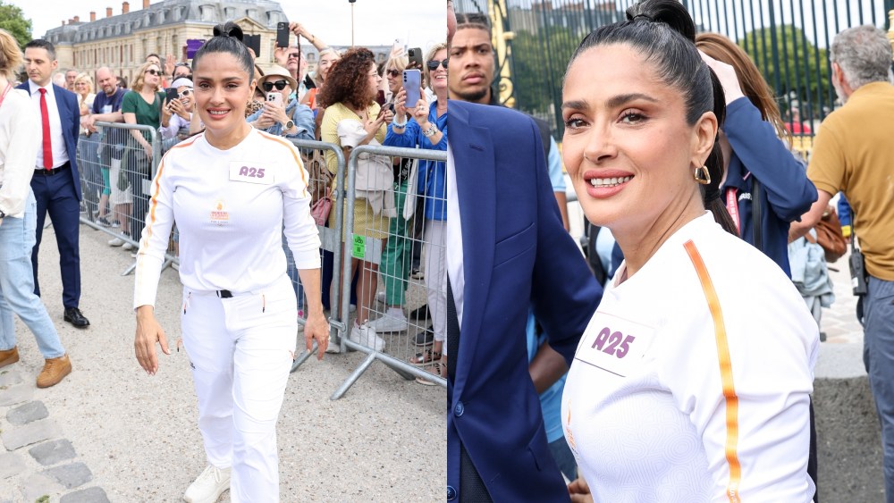 salma-hayek-gets-fired-up-for-paris-olympics-torch-relay-in-tracksuit-uniform-in versailles