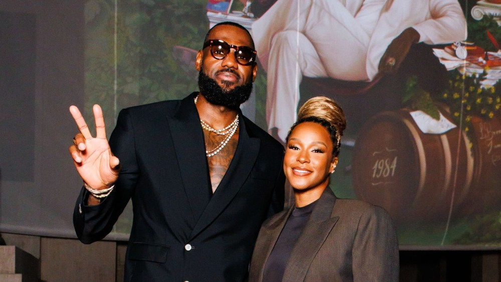 lebron-james-does-taut-tailoring-in-louis-vuitton-for-hennessy-collaboration-launch-and-wife-savannah-favors-oversize-phoebe-philo suit