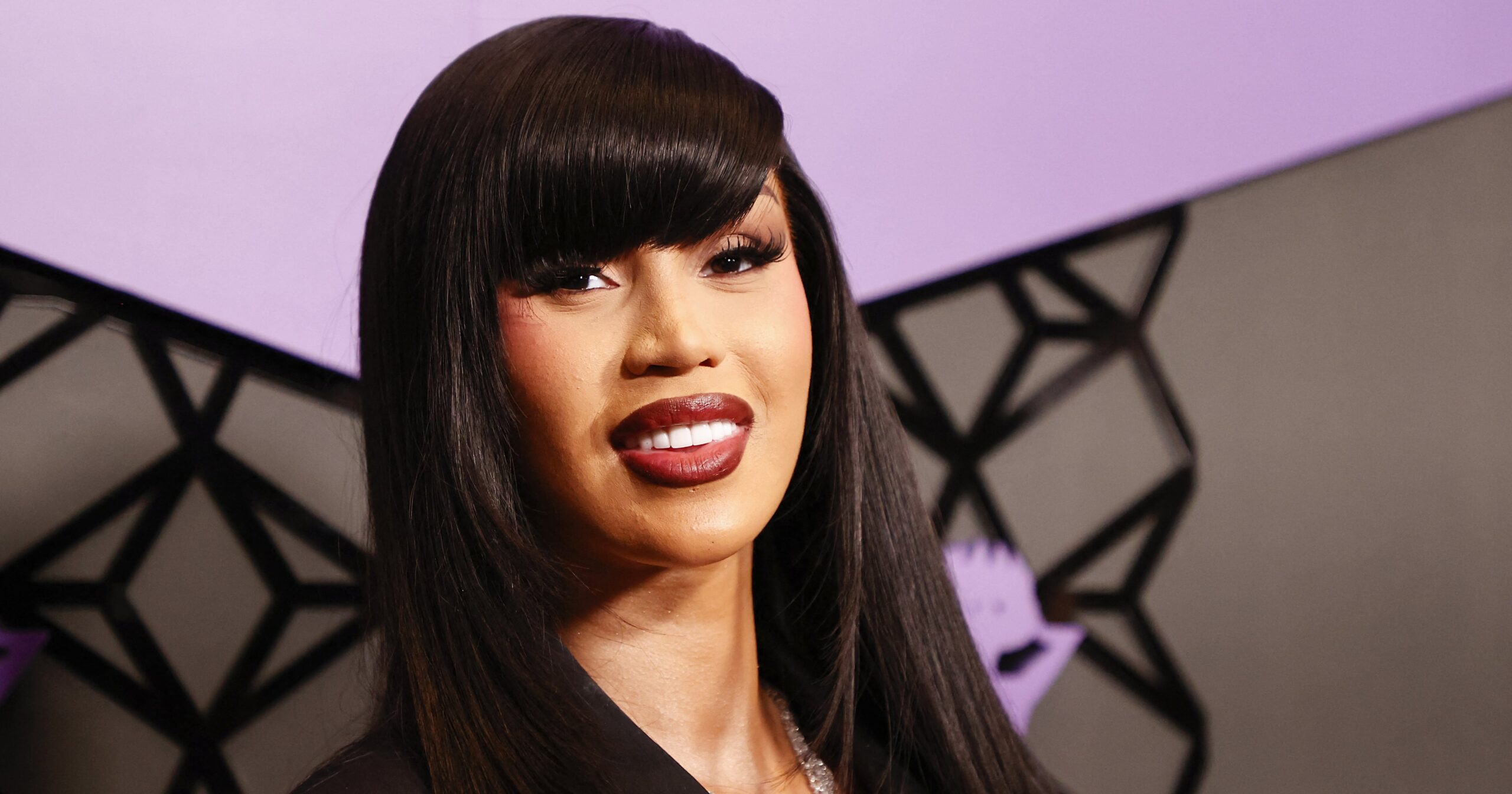 cardi-b-accessorized-her-pearl-fringe-gown-with-a-live-crow