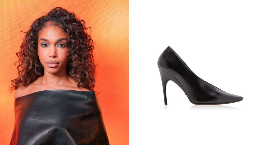 lori-harvey-goes-all-black-in-balenciaga’s-duchesse-pumps-and-leather-cape-top-in paris