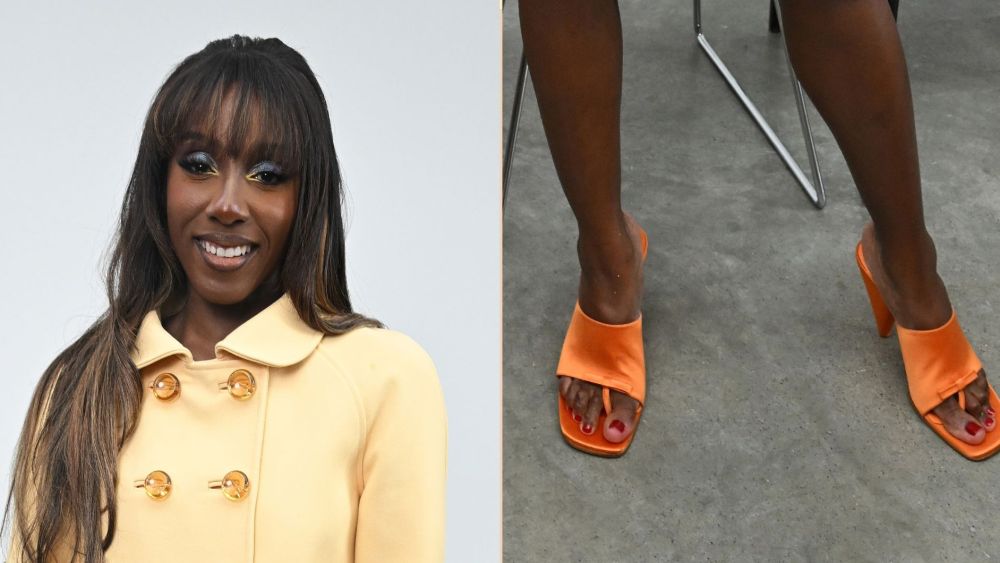 ziwe-takes-fashion-month’s-thong-sandal-trend-to-the-courreges-front-row-in-orange satin